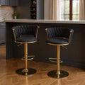 Lot de deux tabourets de bar pivotants à hauteur réglable, dossier bas, en velours noir et doré et métal